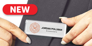 New - Women putting on a name badge on jacket