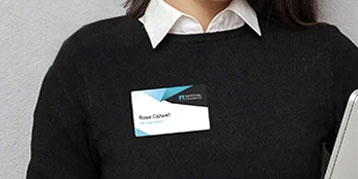 Fabric Name Badge on the jumper of a woman.