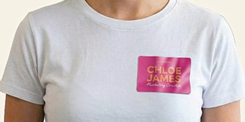 Woman with a Custom Fabric Name Badge on a white tshirt