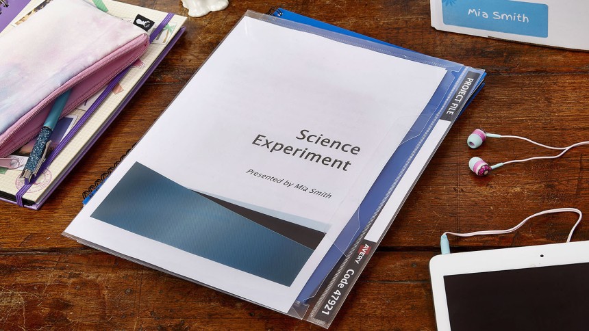 school Avery project files and binders on a desk