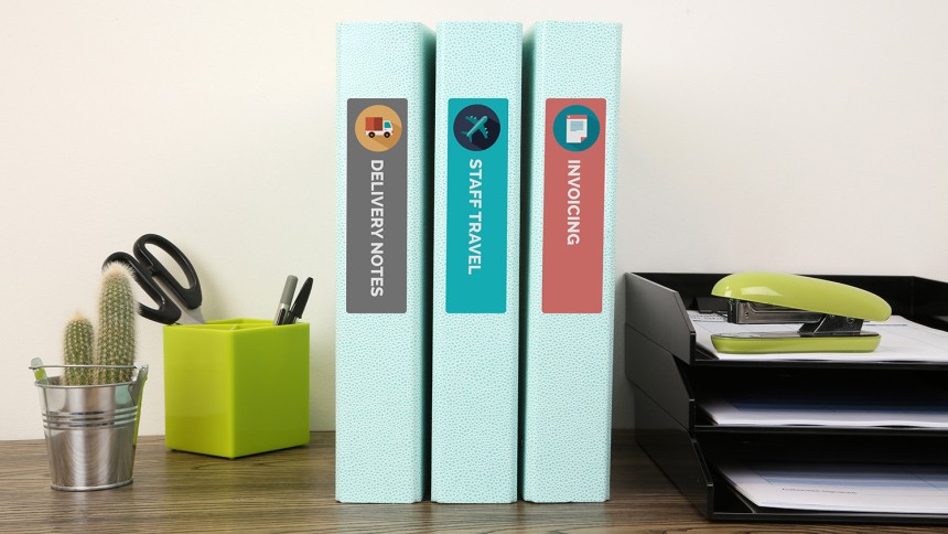 Avery Lever Arch File Spine Labels on folder on desk