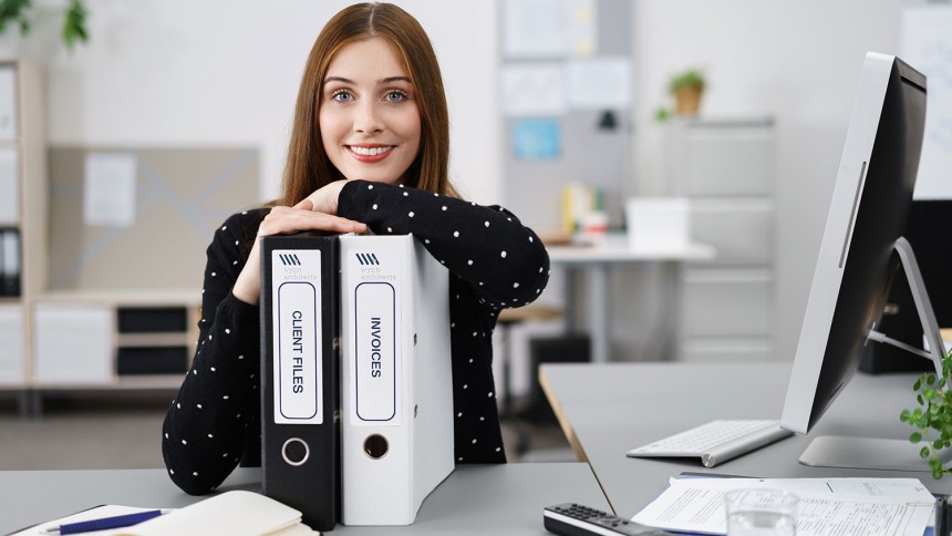 Office worker with organised binder files
