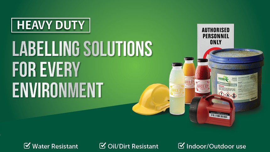 Heavy Duty Labels on Chemical Bottles next to a hard hat with text Labeling Solutions For Every Environment
