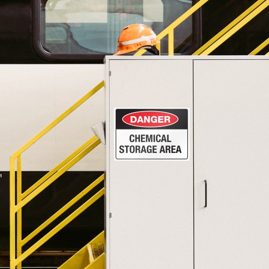 Heavy Duty Sign in industrial factory that reads Danger Chemical Storage Area