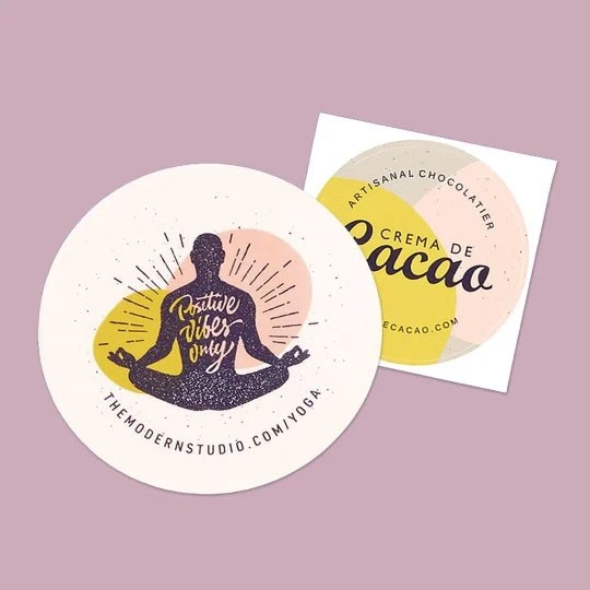 Round Sticker of a Yogi for Yoga Studio and Square Sticker promoting Chocolate Brand Crema De CaCao