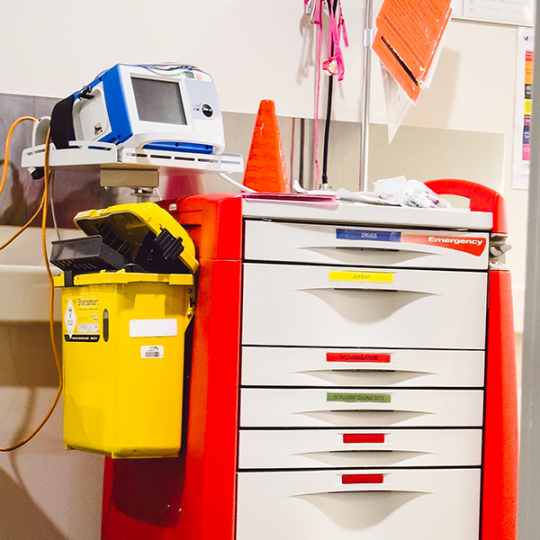 Crash Cart in Hospital with Colourful Labels.