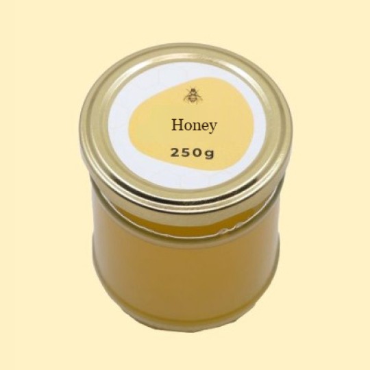 A high-angle view of a short, wide, transparent glass jar of honey with a gold lid. A circular white label is centered on the top of the lid, featuring an abstract, golden-yellow shape with a small illustration of a bee and the text "Honey". Below this, the text "250g" is printed. The jar is set against a plain, light yellow background.