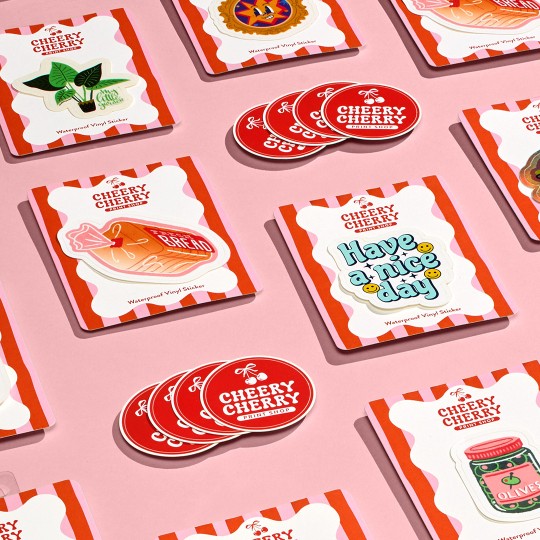 Mix of round and rectangle stickers on pink background