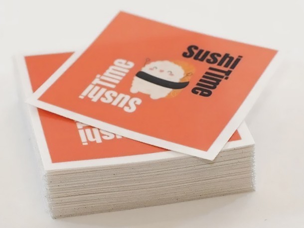 Square custom printed stickers in a pile