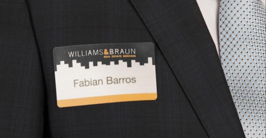 Close up of name badge on suit
