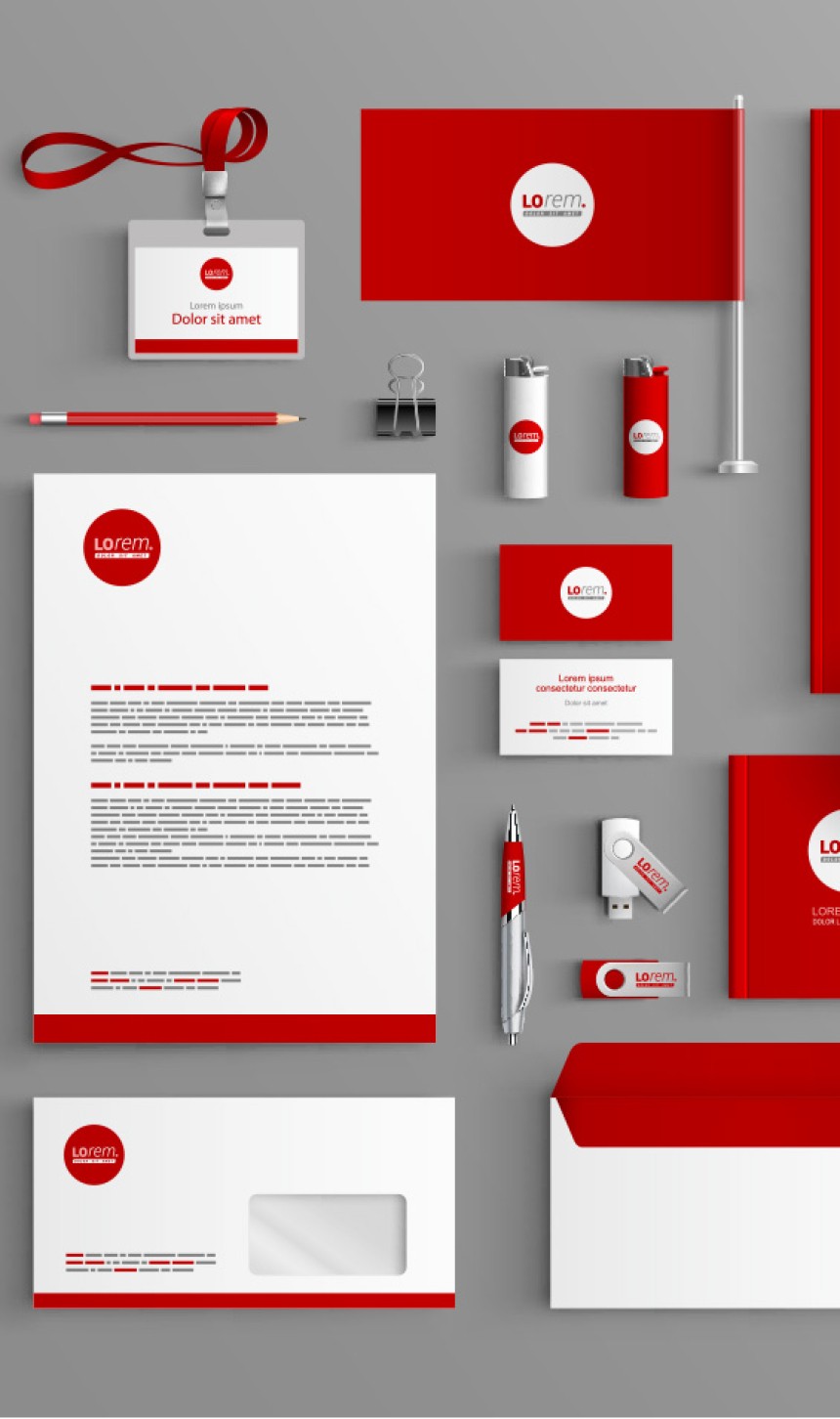 Collection of corporate branded stationery including pencils, letterheads, business cards etc