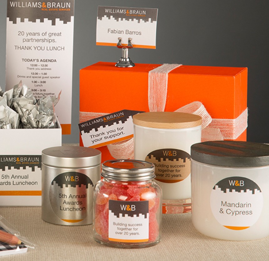 Collection of corporate gifts with assorted Avery labels on them