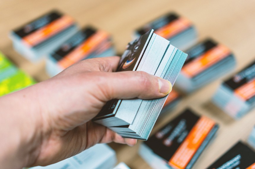 Hand Carrying a stack of business cards