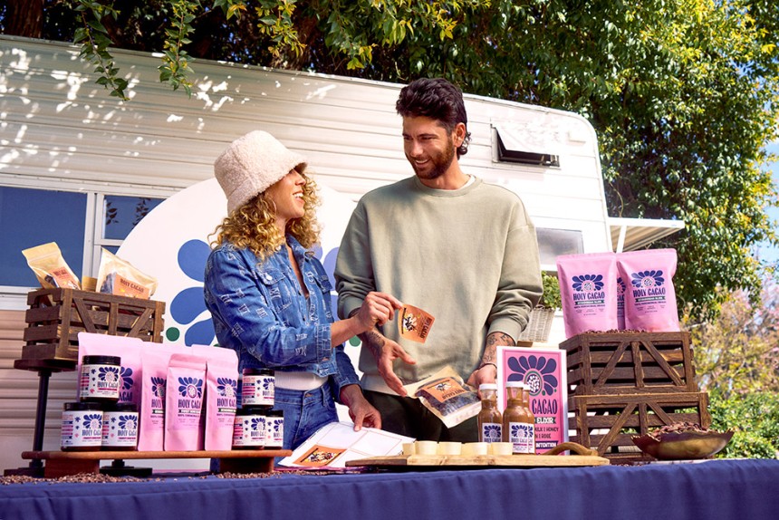 2 people in front of their cacao stall