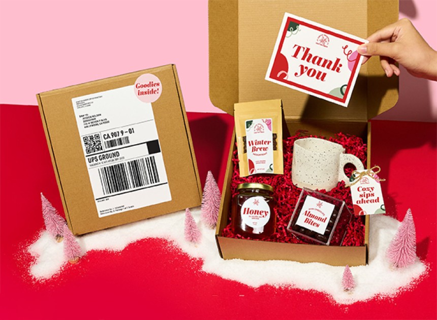 Gift Hamper with thank you card and an assortment of gifts like tea sachet, mug, honey and chocolate all with different sized and shaped product labels.