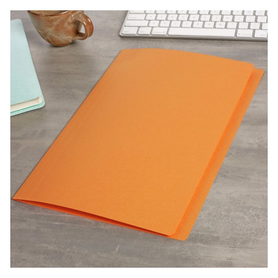 The image features an orange folder on a gray surface, accompanied by a light blue notebook and a brown cup, with a keyboard in the background.