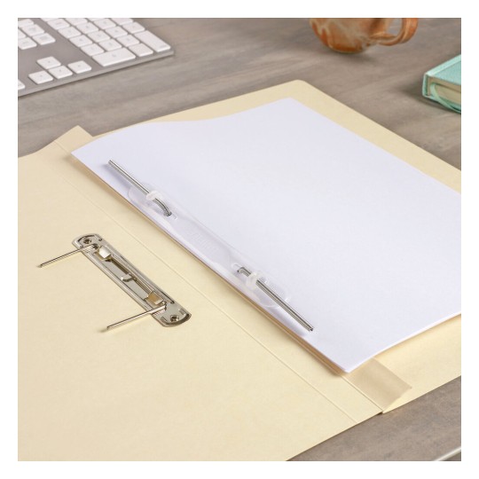 The image shows a folder with a blank sheet of paper secured inside. The folder has a metal clip for holding paper, and there is a computer keyboard and a coffee mug in the background.