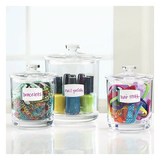 The image displays three glass jars labeled 'bracelets,' 'nail polish,' and 'hair stuff,' containing various colorful items like jewelry, nail polish bottles, and hair accessories.