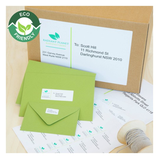 The image features eco-friendly packaging, including a cardboard box and green envelopes. The box has shipping labels with addresses, and there are additional labels on display. The design emphasizes sustainability.