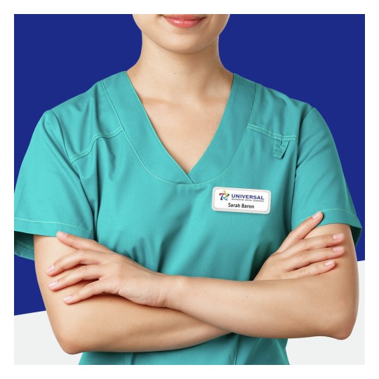 The image shows a woman wearing a teal medical uniform. She is posing with her arms crossed and smiling subtly. A name tag is visible on her uniform, indicating 'UNIVERSAL' and the name 'Sarah Baron'.