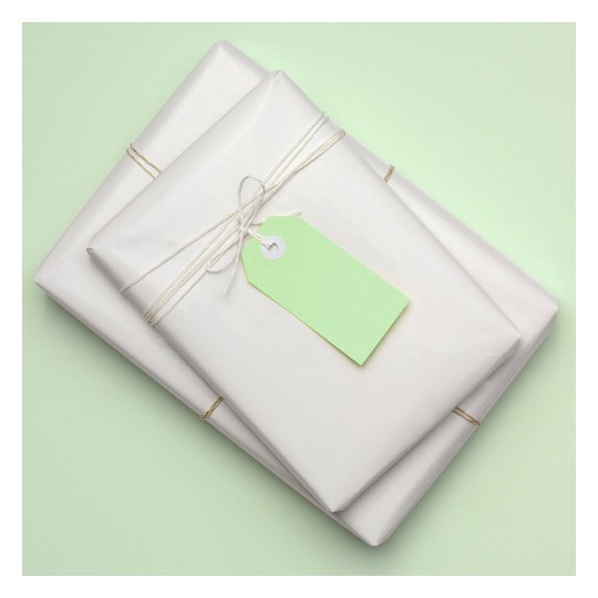 The image features two neatly wrapped packages in white paper, tied with twine. Each package has a green tag attached, resting on a light green background.