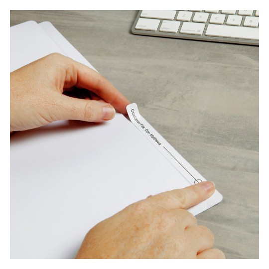 The image shows a hand holding a tab on a file labeled 'Customer File: Don Matthews', with a keyboard in the background.