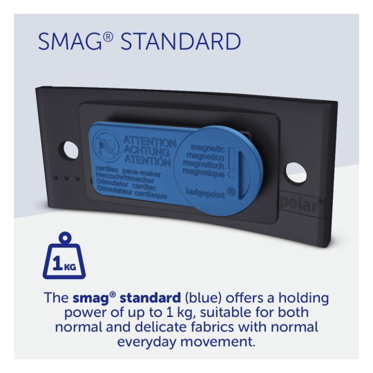 The image shows a blue magnetic fastener called 'SMAG® Standard' with safety warnings related to its use on fabrics. It includes information about its holding power of up to 1 kg and suitability for different types of fabrics.
