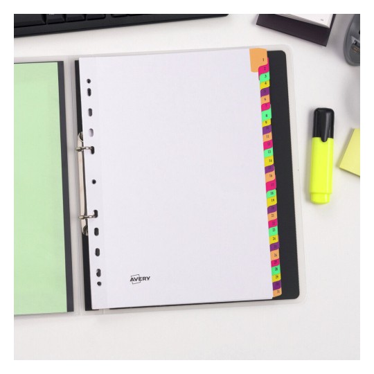 The image shows an open binder with blank white paper, colored tab dividers, and a highlighter on a desk. The binder features the Avery logo.