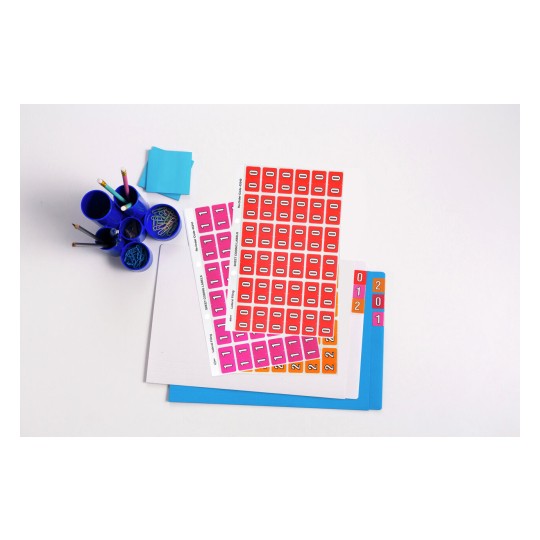 The image features a collection of colorful office supplies including stickers or labels with numbers, stacked sheets of paper, and a blue cup containing various writing instruments and paper clips. There are also sticky notes visible in vibrant colors.