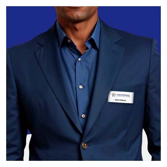 The image features a person in a dark blue suit and shirt, wearing a nametag that says 'Brian Fieldman' with the logo of 'Universal'.