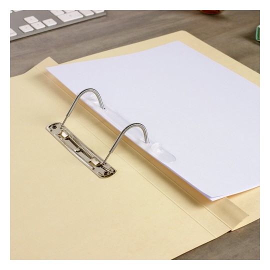 The image shows a yellow folder with a sheet of white paper inside, secured by a binder mechanism. A keyboard is visible in the background.