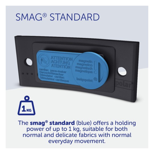 The image shows the SMAG® Standard device, which is blue and has a holding power of up to 1 kg. It's designed for use with normal and delicate fabrics with everyday movements. It includes safety warnings regarding use with cardiac pacemakers.