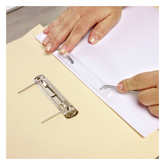 A close-up of hands placing a white paper into a folder, with a metal binder clip visible. The hands are interacting with the folder and paper.