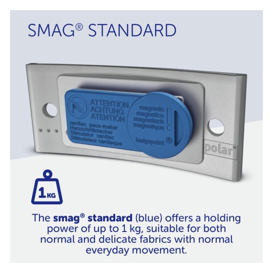 The image features a product called SMAG® Standard. It is a blue magnetic attachment designed for fabrics, with a holding power of up to 1 kg. It includes warnings for cardiac pacemaker users and is suitable for both normal and delicate fabrics.