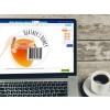 Laptop screen next to a cup of coffee, showing a honey image, text reading heather's hone, and a barcode.