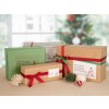 Christmas Gifts wrapped in Green, white and kraft packages with red and green bows with address labels in a variety of shapes and designs.