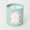 Custom printed arched label applied to a candle jar.