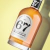 Bottle of whiskey on a yellow background with an arched shaped white label on the bottle