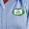 Oval shaped name badge label on womens shirt.