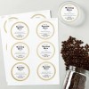 A sheet of round custom labels reading “Roasted Beans” beside a jar spilling coffee beans and a labeled container lid.