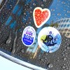 Printed Car Stickers on a window with water droplets.