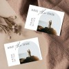 Save the Date Card with an image of a couple getting married on the beach.