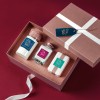 Gift box of beauty products with different coloured product labels and a gift tag