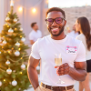 Jamaican man at a christmas party with a fabric name badge
