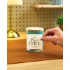 Hand applying a candle label