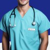 The image features a person wearing a teal medical scrub top with a stethoscope around their neck. The individual has a name tag visible on the left side of the chest area, and the background is a solid blue color.